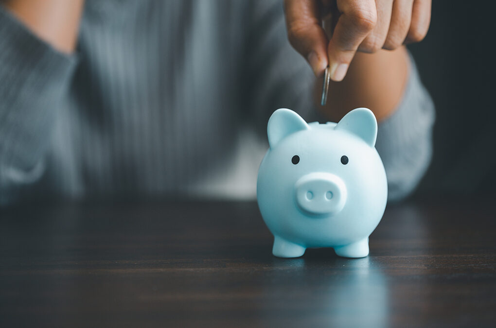 A blue piggy bank - how to pay for IVF and surrogacy